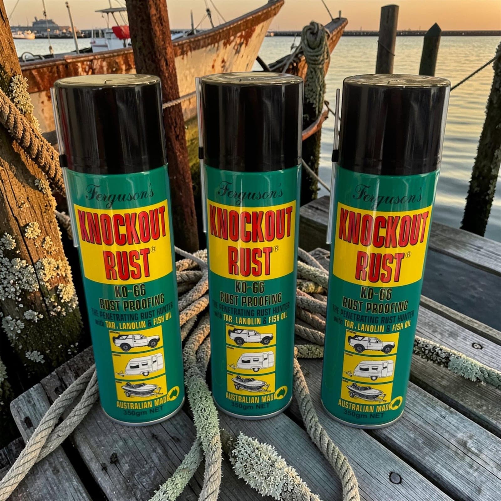 Three cans of Ferguson's Knockout Rust KO-66 rust proofing, stocked at Warana, on a jetty at the water